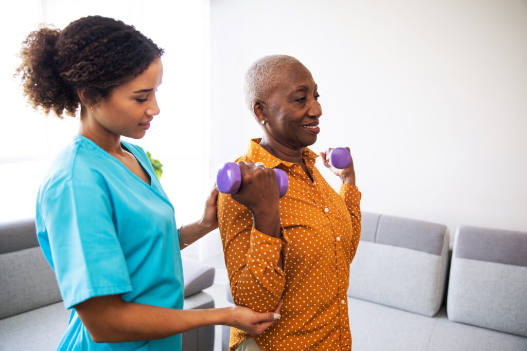 physical therapist with her patient at home